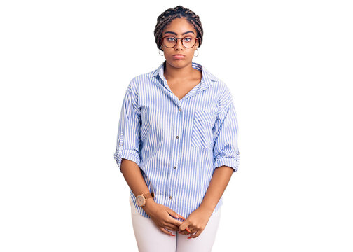 Young african american woman with braids wearing casual clothes and glasses depressed and worry for distress, crying angry and afraid. sad expression.
