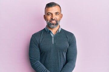 Fototapeta premium Middle age handsome man wearing casual clothes with a happy and cool smile on face. lucky person.