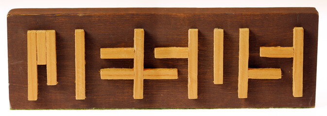 Wood sticks on a block forming a cryptic Jesus