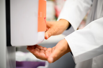 Hand sanitizer alcohol gel rub clean hands hygiene prevention of coronavirus virus outbreak. Man...