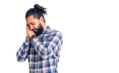 Young arab man wearing casual clothes sleeping tired dreaming and posing with hands together while smiling with closed eyes.
