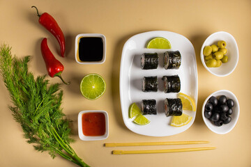 A set of sushi rolls is served on a light background. Japanese menu. Delicious traditional japanese...