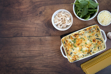 Chicken Spinach Lasagna on a Wooden Background