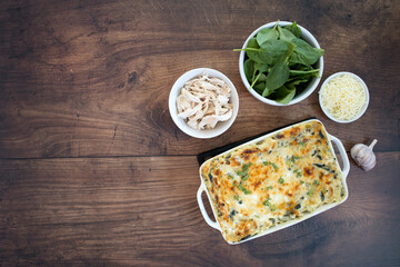 Chicken Spinach Lasagna on a Wooden Background
