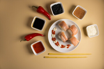A set of sushi rolls is served on a light background. Japanese menu. Delicious traditional japanese food with sushi rolls.
