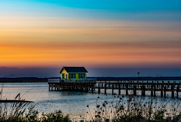 Sunset over fishing house in Chincoteague Bay Virginia