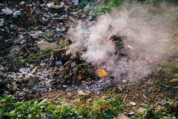 various kinds of garbage in the trash that are burned cause air pollution