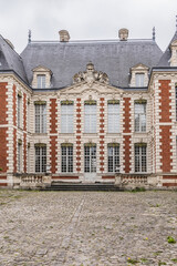 Beautiful architecture of ancient French buildings: Brick and stone building known today as Hotel...
