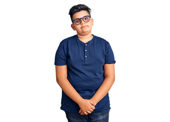 Fototapeta premium Little boy kid wearing casual clothes and glasses relaxed with serious expression on face. simple and natural looking at the camera.