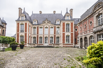 Beautiful architecture of ancient French buildings: Brick and stone building known today as Hotel de Berny built during the years 1633 and 1634. Amiens. Somme department, Picardie, France. 