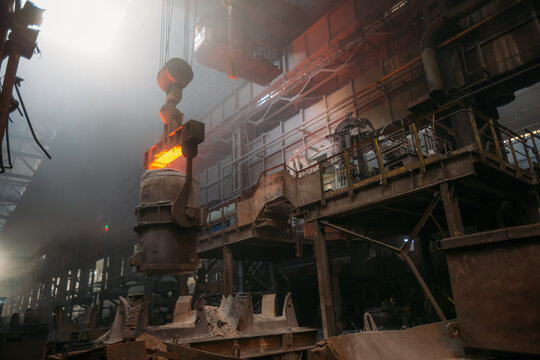 Iron casting and the foundry. Overhead crane with ladle with molten metal at metallurgical factory