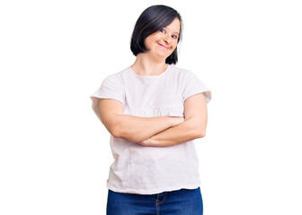 Brunette woman with down syndrome wearing casual white tshirt happy face smiling with crossed arms looking at the camera. positive person.