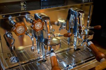 Close up of wood and still lever espresso machine