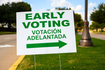 A sign directs residents to an early voting polling location for the 2020 Presidential election.