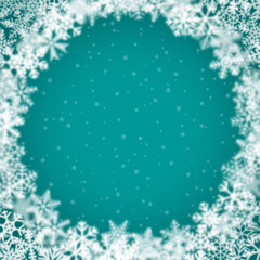 Fototapeta premium Christmas background of snowflakes of different shape, blur and transparency, arranged in a circle, on turquoise background