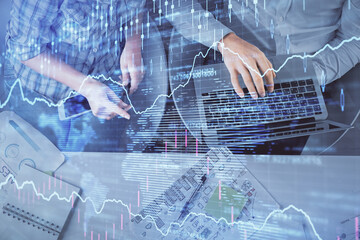 Multi exposure of man and woman working together and forex graph hologram drawing. Financial analysis concept. Computer background. Top View.