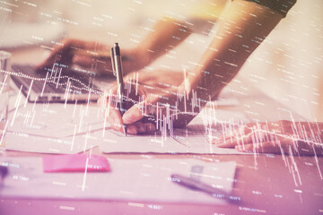 Multi exposure of woman hands typing on computer and financial chart hologram drawing. Stock market analysis concept.