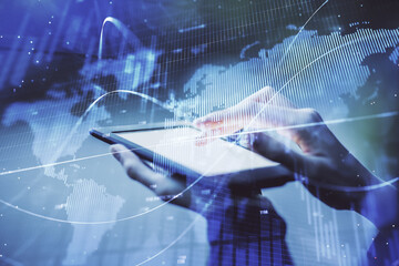 Double exposure of forex chart sketch hologram and woman holding and using a mobile device....