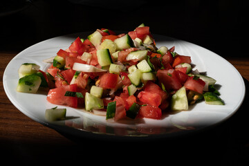 Shepherds salad (Coban salata in Turkish) in white bowl.