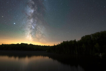 The Milky Way Rises Over A Lake In Algonquin Park, Canada
