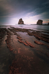 The famous twin rocks at Hendaia's coast, Basque Country.	
