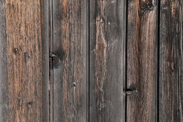 Old  dark brown wooden plank, natrual hardwood weathered, space for text. close up and no person
