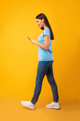 Portrait of beautiful young woman using her mobile phone