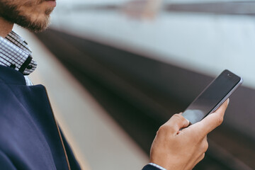 close up . smartphone in the hand of a metro passenger .