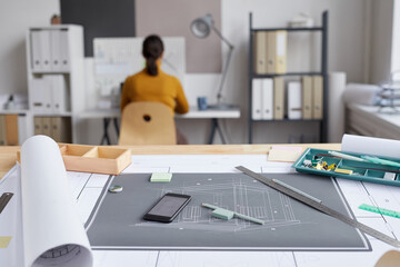 Background image of blueprints and plans on drawing desk at architects workplace, copy space