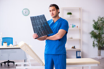 Young male doctor radiologist working in the clinic