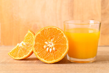 Fresh Honey Murcott orange fruit and juice on wooden background, Healthy drink
