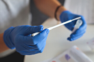 Process of coronavirus testing examination at home, COVID-19 swab collection kit, test tube for taking OP NP patient specimen sample, testing carried out, patient receiving a corona test - obrazy, fototapety, plakaty