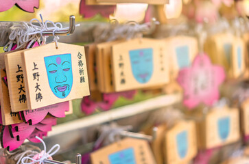 tokyo, japan - october 10 2020: Illustration of a blue face on Ema plaques famous among students during exams because like the face of Ueno Buddha fallen down in earthquake they can't fail anymore.