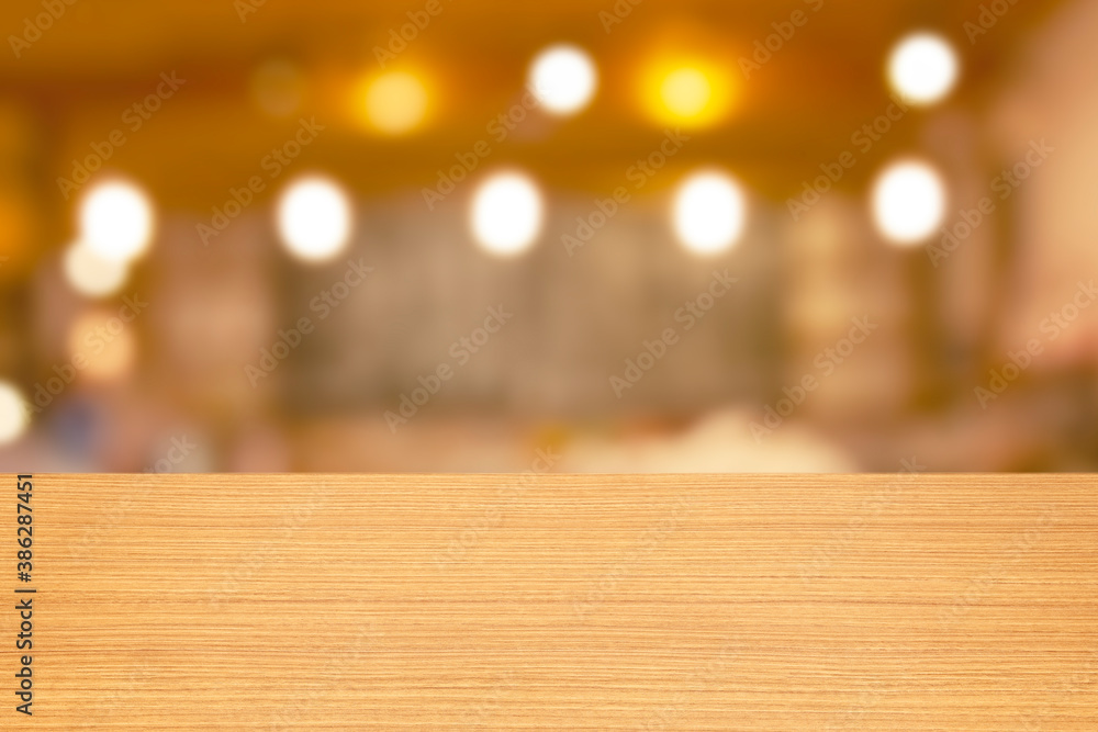 Poster empty wooden table and blur bar and cafe background with counter and light bokeh, restaurants. ready