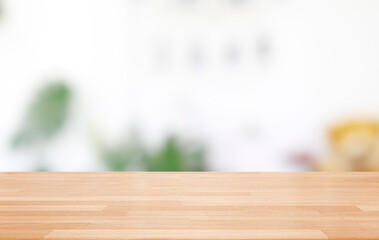 Empty wooden table and blurred modern indoor white kitchen coffee cafe background, restaurants. Ready for product montage display. template