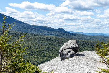 Boulders rest near the edge of one of the many granite slabs that form the summit of the Sugarloafs in the White Mountains