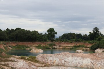 Fototapeta na wymiar Grand Canyon, a beautiful green pond formed by nature with white rocks, minerals and sulfur, Unseen Thailand, New Tourism, Uttaradit. Natural background