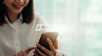 Smile woman hand using smartphone and press screen to search Browsing on the Internet online.