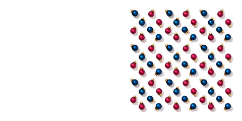 Christmas frame with bright shiny little red and blue round small balls isolated on white background. New Year greeting card.