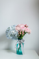 Beautiful flowers in the glass vase.