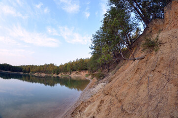 Fototapeta na wymiar Blue Lake in the Chernigow region, Ukraine. Former quarry of quartz sand for glass production. Popular local resort at present