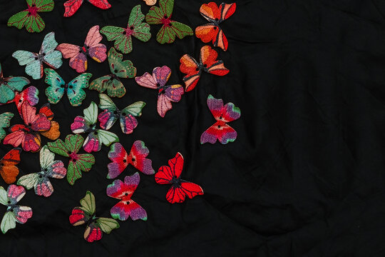 decorative butterflies made of wood on a black background