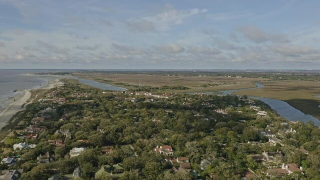 Sea Island Georgia Aerial v2 panning shot from afar of affluent, coastal neighborhood and resorts - March 2020