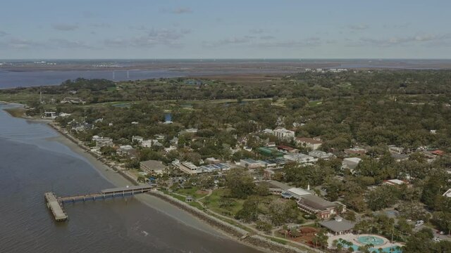 St Simons Georgia Aerial v13 dolly out shot of landscape, town and Atlantic Ocean - March 2020