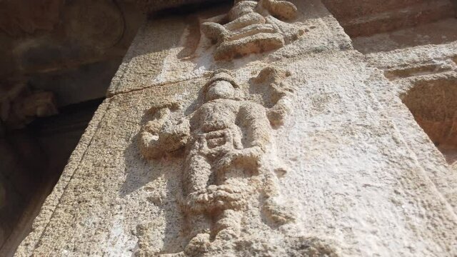 Fast Tracking Shot of Figure on Side of Colonnade of Ancient Temple at Hampi, Karnataka, India