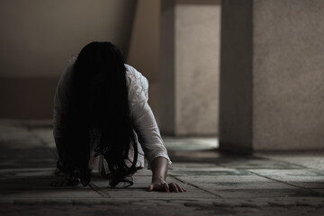 Female zombie in blood. Asian Woman ghost with blood. Horror scary fear in dark house creepy...