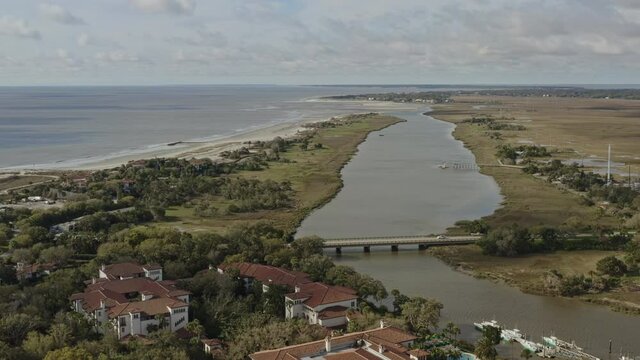 Sea Island Georgia Aerial v7 pan right shot of coast and entrance bridge by the river - March 2020