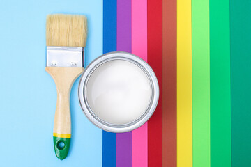 Open paint enamel cans on color palette samples