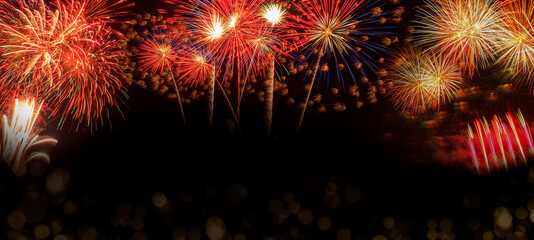 Beautiful fireworks colorful on black web banner background, wide space to put text.