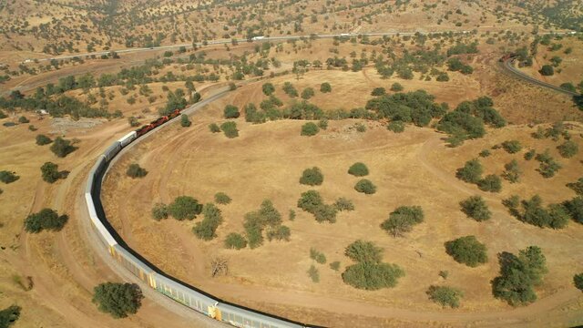 Train on a railway in Tehachapi California - Aerial View